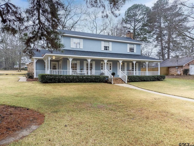 country-style home with covered porch and a front lawn