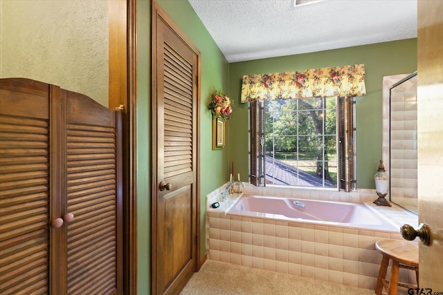 408 E Forest Dr, White Oak, TX 75693 - full bath featuring a garden tub, a textured ceiling, and a closet