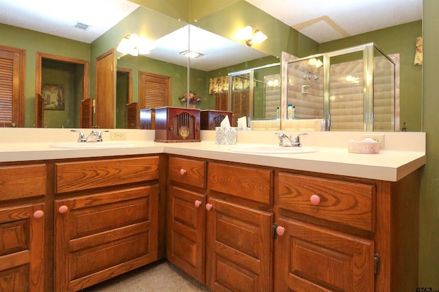 bathroom featuring vanity and an enclosed shower