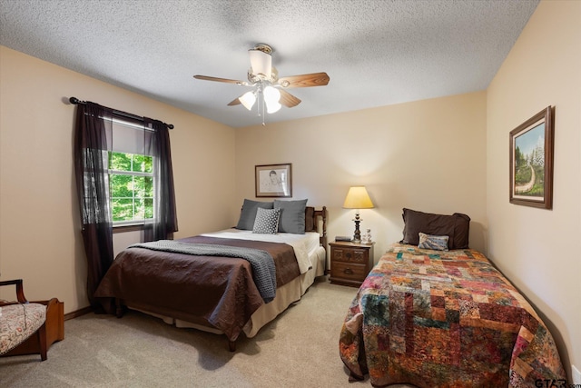 408 E Forest Dr, White Oak, TX 75693 - bedroom with light colored carpet, ceiling fan, and a textured ceiling