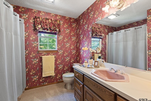 408 E Forest Dr, White Oak, TX 75693 - bathroom with a textured ceiling, toilet, baseboards, vanity, and wallpapered walls