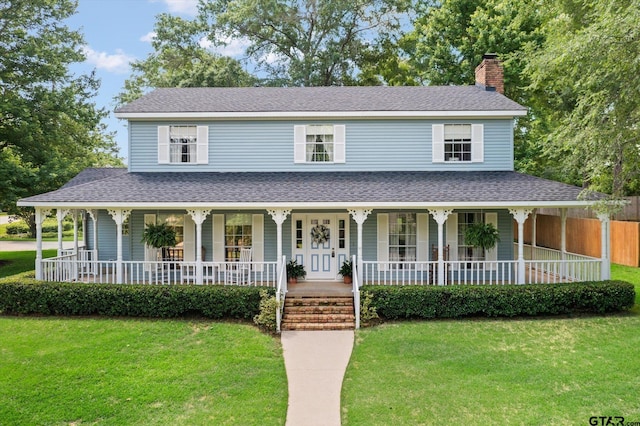 408 E Forest Dr, White Oak, TX 75693 - farmhouse-style home with a porch, a chimney, a front lawn, and roof with shingles