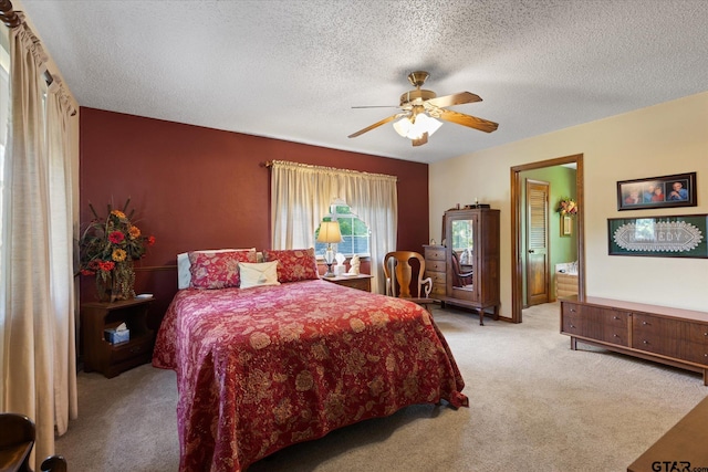 408 E Forest Dr, White Oak, TX 75693 - bedroom with carpet, a textured ceiling, and a ceiling fan