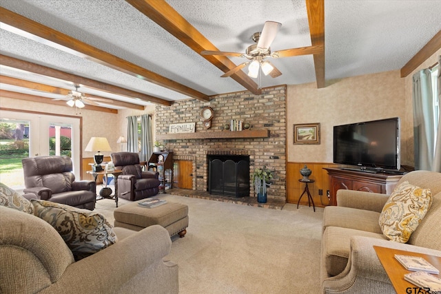 408 E Forest Dr, White Oak, TX 75693 - living room with a ceiling fan, wainscoting, beam ceiling, a textured ceiling, and carpet flooring