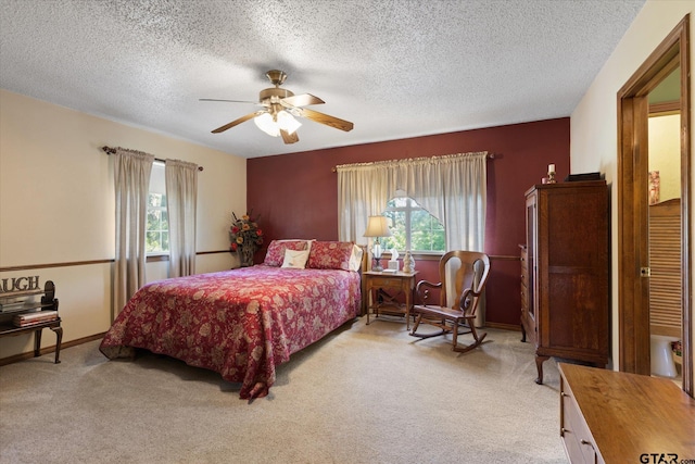408 E Forest Dr, White Oak, TX 75693 - bedroom featuring multiple windows, light colored carpet, a textured ceiling, and ceiling fan