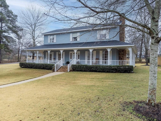 country-style home with a porch and a front lawn