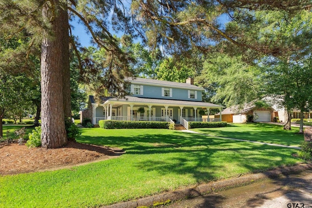 408 E Forest Dr, White Oak, TX 75693 - farmhouse featuring covered porch, a chimney, and a front lawn