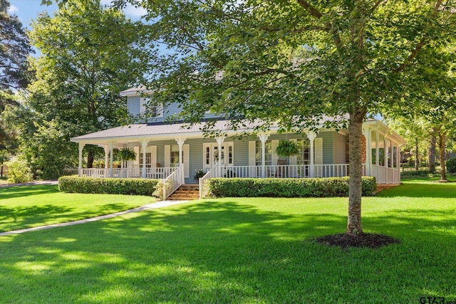 408 E Forest Dr, White Oak, TX 75693 - view of front facade featuring covered porch and a front yard