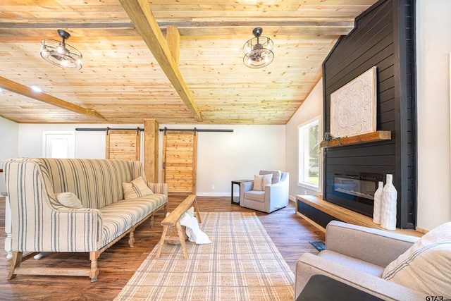 living room with wood ceiling, lofted ceiling with beams, and a barn door