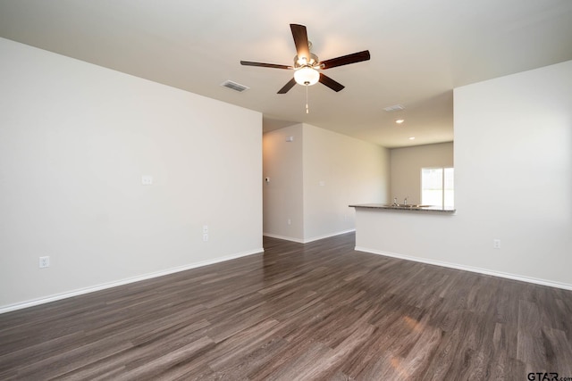 1439 Monterey Dr, Longview, TX 75601 - spare room with dark wood-type flooring, a ceiling fan, and recessed lighting