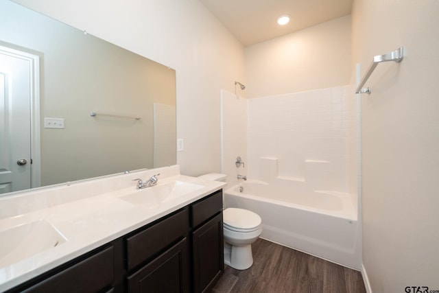 1439 Monterey Dr, Longview, TX 75601 - full bath featuring wood finished floors, double vanity, shower / bath combination, and recessed lighting