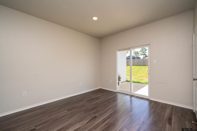 1439 Monterey Dr, Longview, TX 75601 - empty room featuring dark wood-style floors and recessed lighting