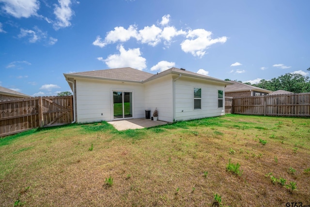 1439 Monterey Dr, Longview, TX 75601 - back of property with a fenced backyard, a patio, and a gate