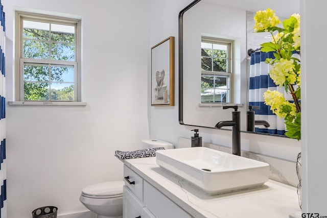 bathroom with vanity and toilet