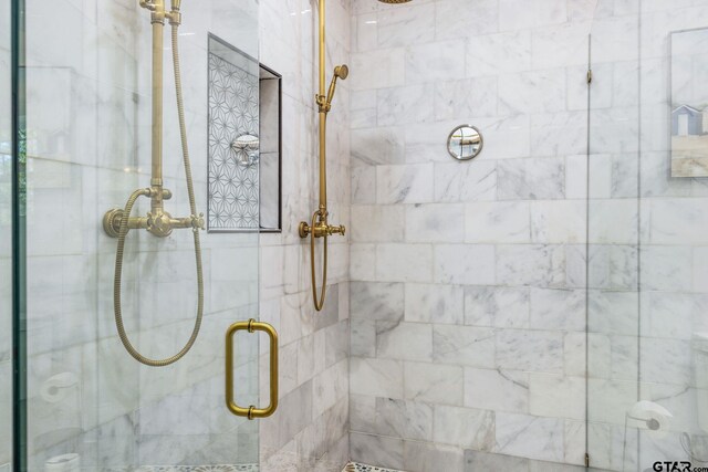 bathroom with an enclosed shower