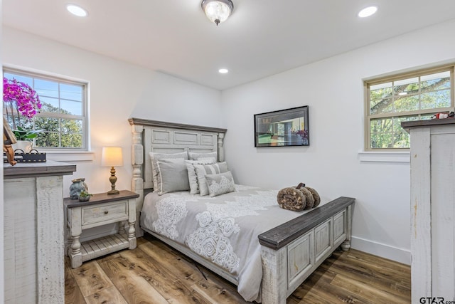 bedroom featuring dark hardwood / wood-style flooring