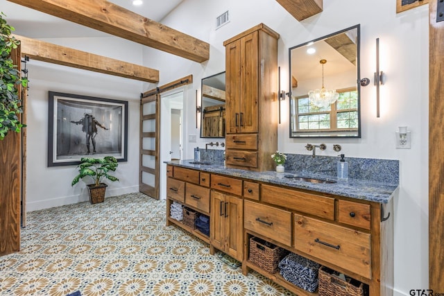 bathroom featuring beamed ceiling, vanity, and an inviting chandelier