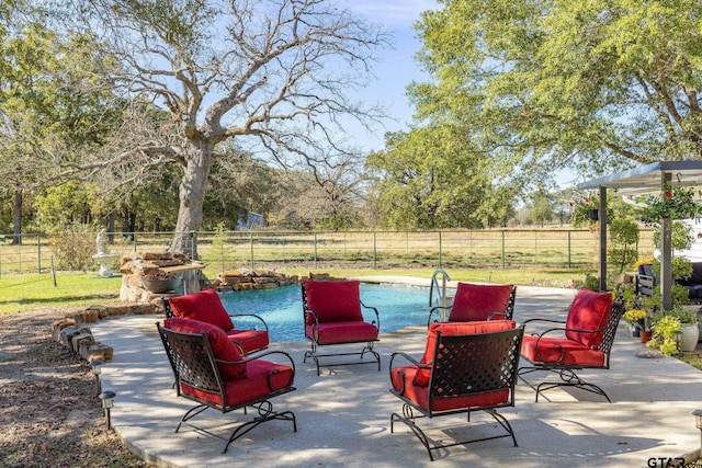 view of patio featuring a fire pit and a fenced in pool