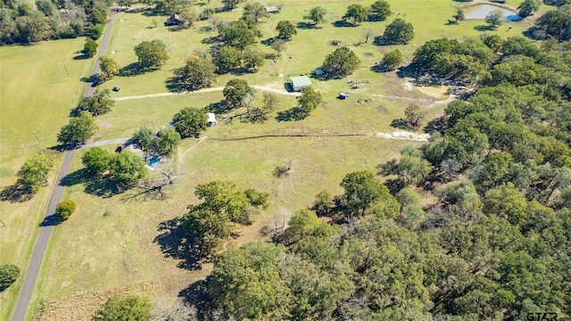 birds eye view of property featuring a rural view and a water view