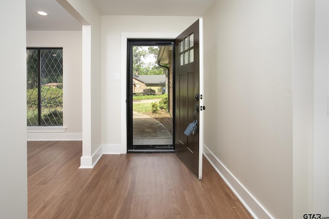 foyer featuring recessed lighting, baseboards, and wood finished floors