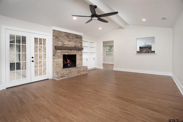 unfurnished living room with baseboards, a ceiling fan, french doors, and wood finished floors