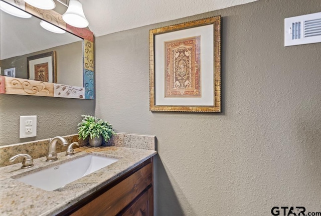 16887 Rainbow Ridge Cir, Tyler, TX 75707 - bathroom featuring vanity and a textured wall