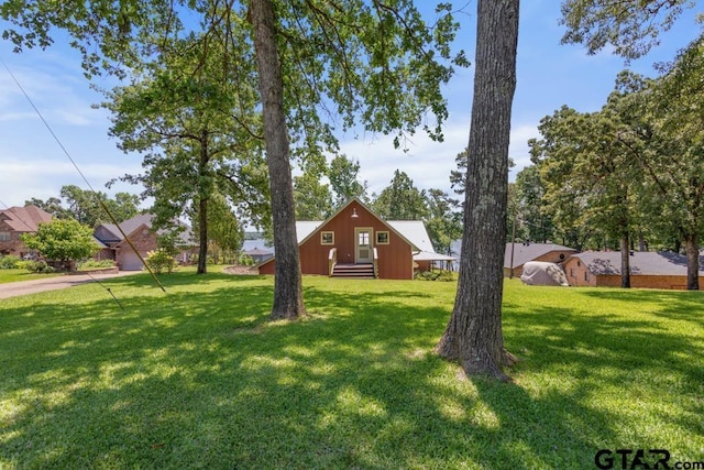 16887 Rainbow Ridge Cir, Tyler, TX 75707 - view of green lawn featuring driveway and entry steps