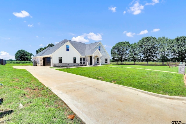 view of front facade with a front lawn and a garage