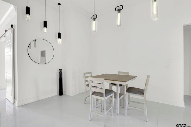 dining area with a barn door