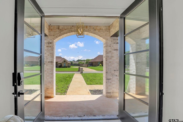 doorway to outside with brick wall