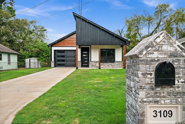 view of front of property with a storage shed and a front lawn