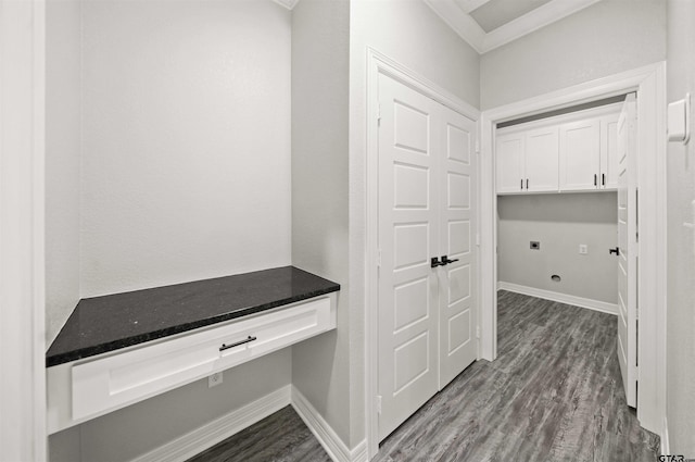 mudroom with built in desk and dark hardwood / wood-style floors