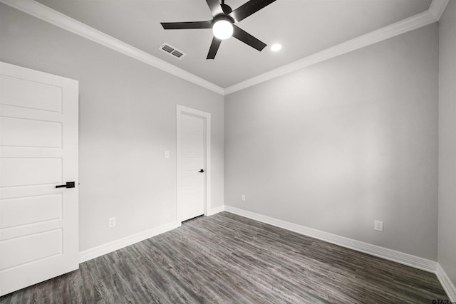 spare room featuring ceiling fan, crown molding, and dark hardwood / wood-style flooring