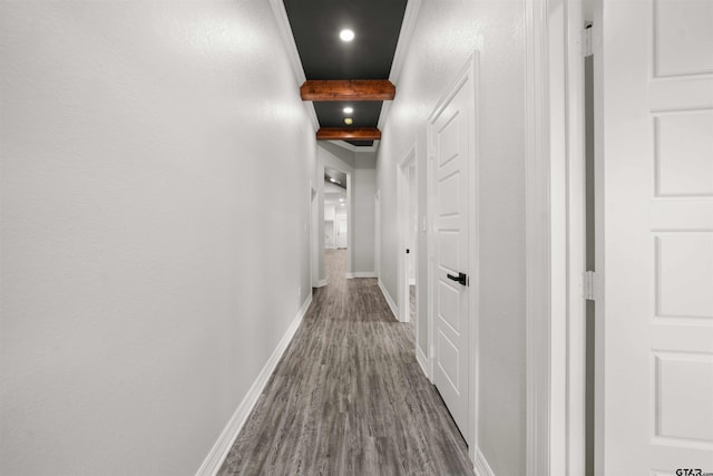 hallway with beamed ceiling and dark hardwood / wood-style floors