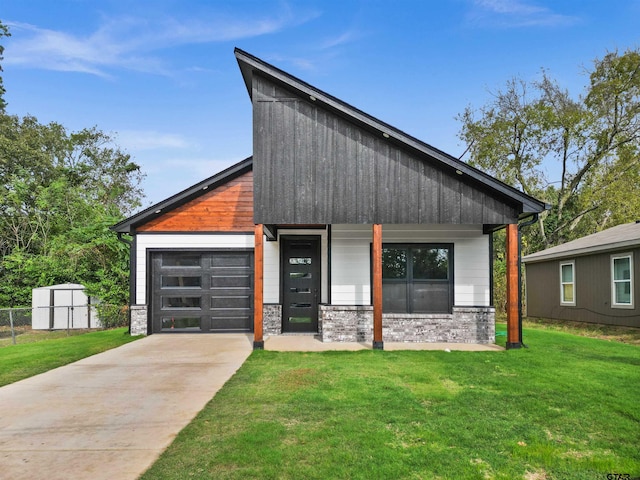 modern home with covered porch and a front lawn