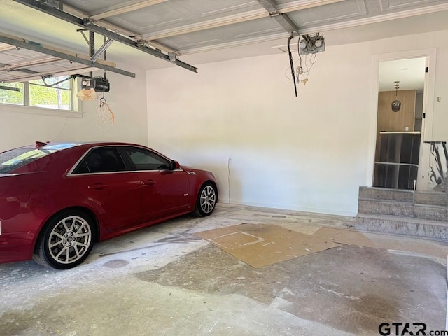 1113 Swanson Dr, Palestine, TX 75801 - garage with a garage door opener