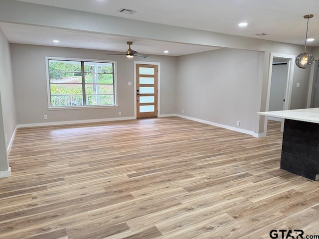1113 Swanson Dr, Palestine, TX 75801 - unfurnished living room with light wood-style floors, baseboards, recessed lighting, and ceiling fan