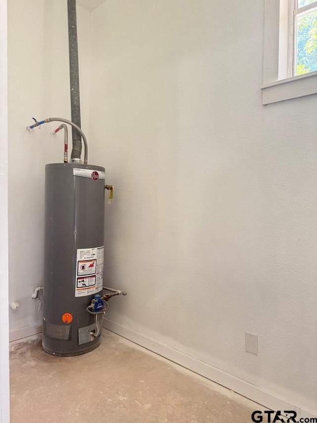 1113 Swanson Dr, Palestine, TX 75801 - utility room with water heater