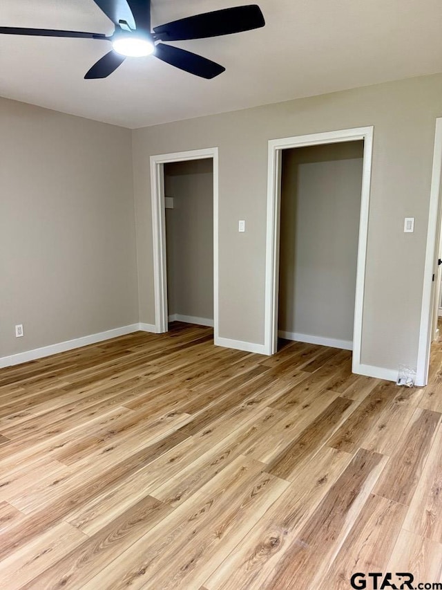 1113 Swanson Dr, Palestine, TX 75801 - unfurnished bedroom featuring light wood finished floors, baseboards, and ceiling fan