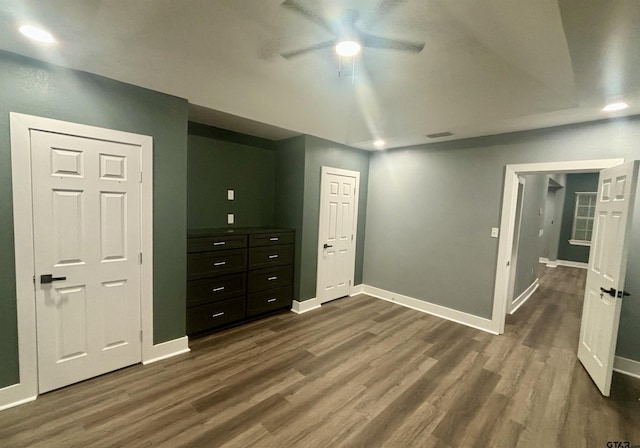 bedroom featuring dark hardwood / wood-style flooring and ceiling fan