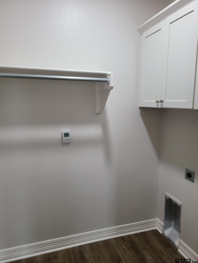 clothes washing area with cabinets, dark wood-type flooring, and electric dryer hookup