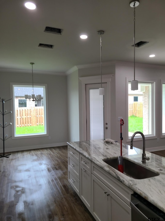 kitchen with light stone counters, white cabinetry, dark hardwood / wood-style floors, sink, and dishwasher