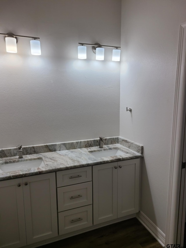 bathroom featuring hardwood / wood-style floors and vanity