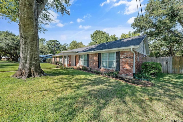 ranch-style house with a front yard