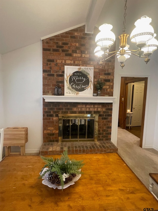 unfurnished living room with an inviting chandelier, a brick fireplace, wood-type flooring, and vaulted ceiling with beams