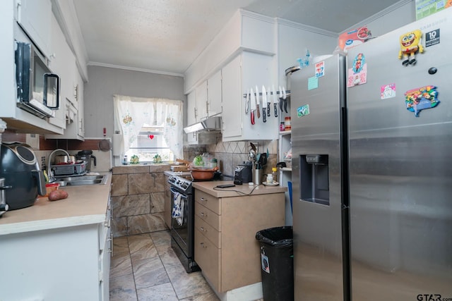 kitchen with under cabinet range hood, a sink, white cabinets, light countertops, and appliances with stainless steel finishes