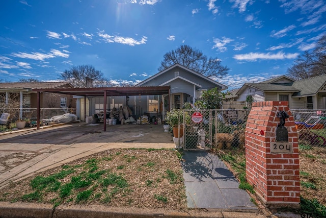 view of front of home featuring fence and driveway