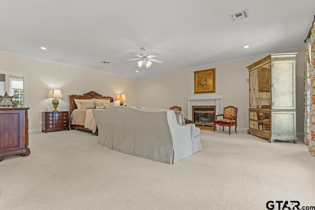 bedroom featuring light carpet, a brick fireplace, crown molding, and ceiling fan