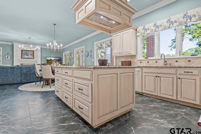 kitchen featuring crown molding, sink, tasteful backsplash, and decorative light fixtures