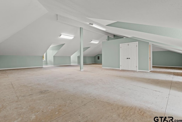 bonus room featuring vaulted ceiling